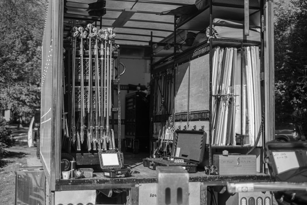 a black and white photo of a truck with its doors open