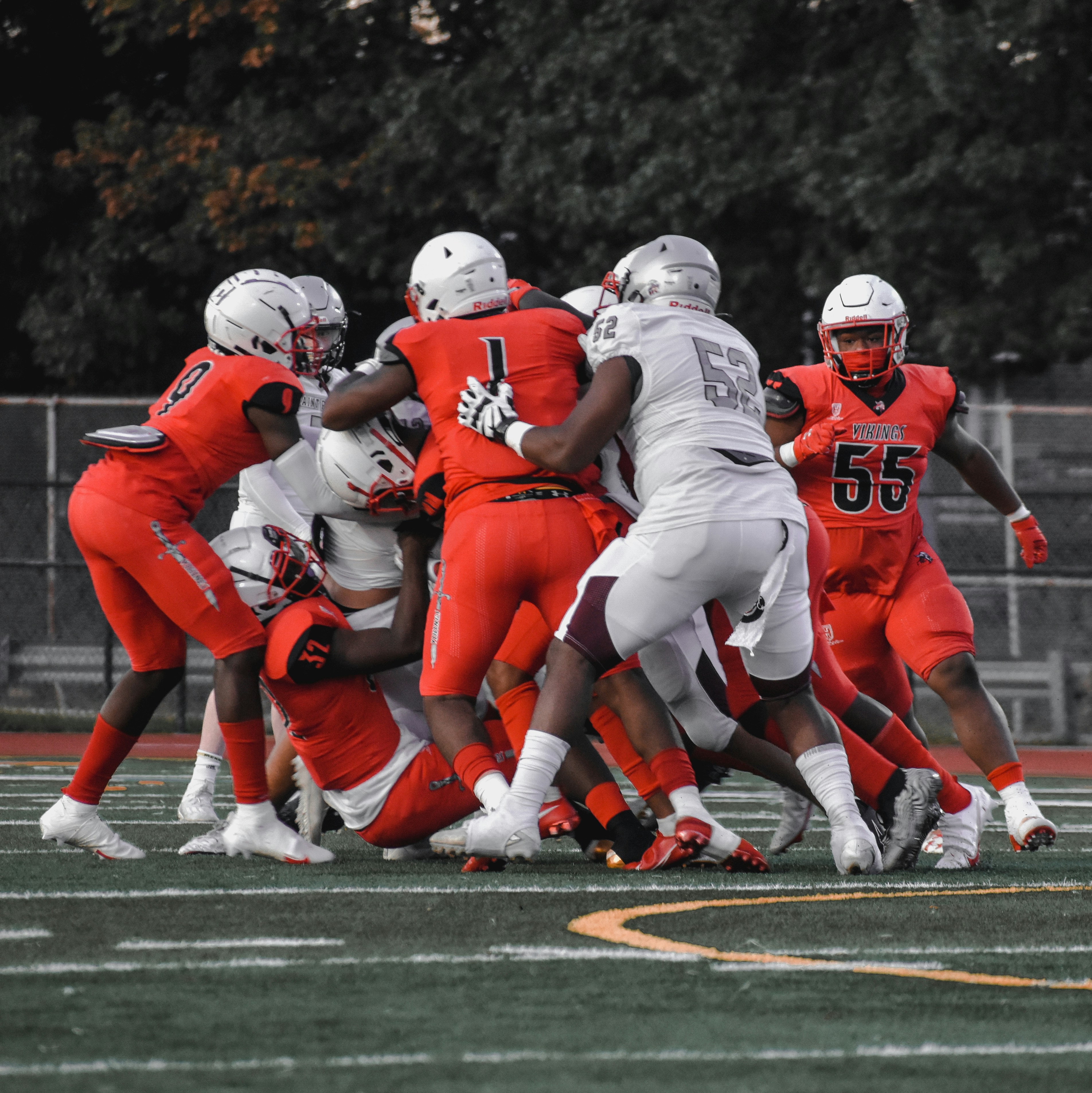 a group of people on a field playing football