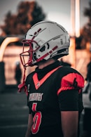a person wearing a football uniform and a helmet
