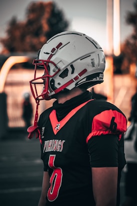 a person wearing a football uniform and a helmet