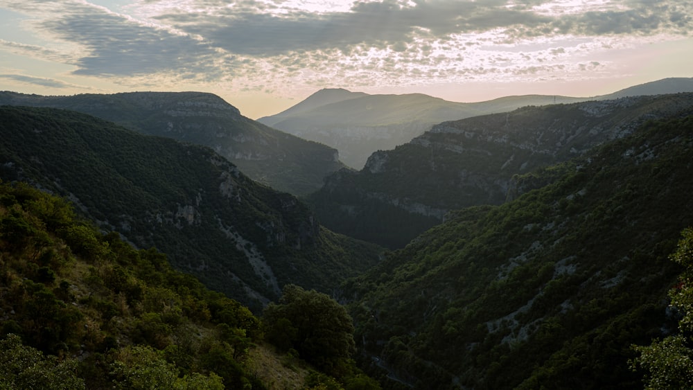 a view of a valley with mountains in the background