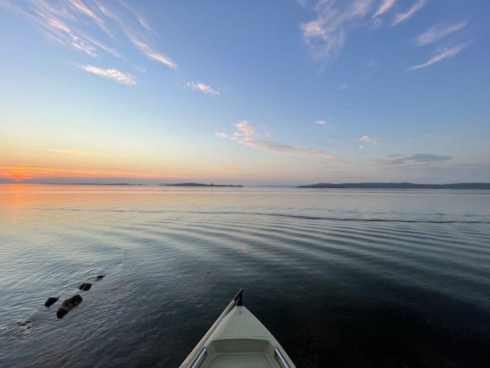 a boat traveling across a large body of water