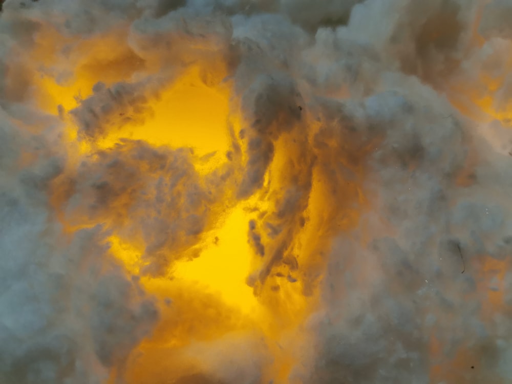 a large cloud of yellow and white smoke
