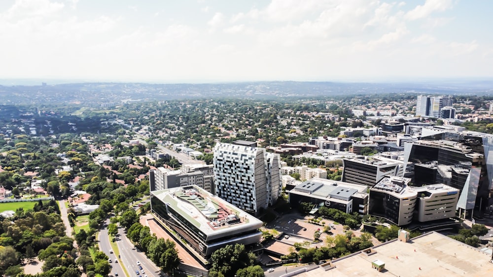 an aerial view of a city with tall buildings