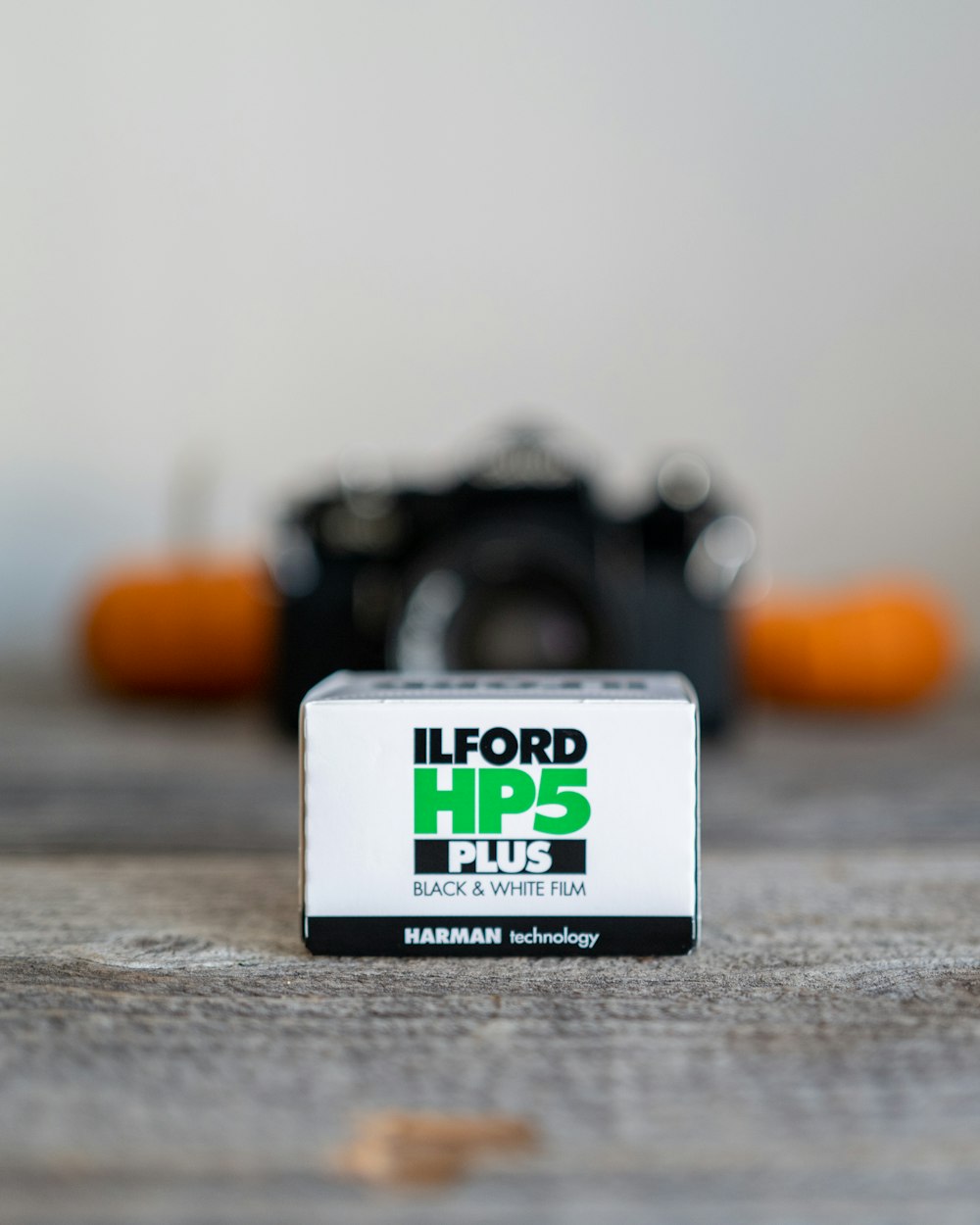 a camera sitting on top of a wooden table