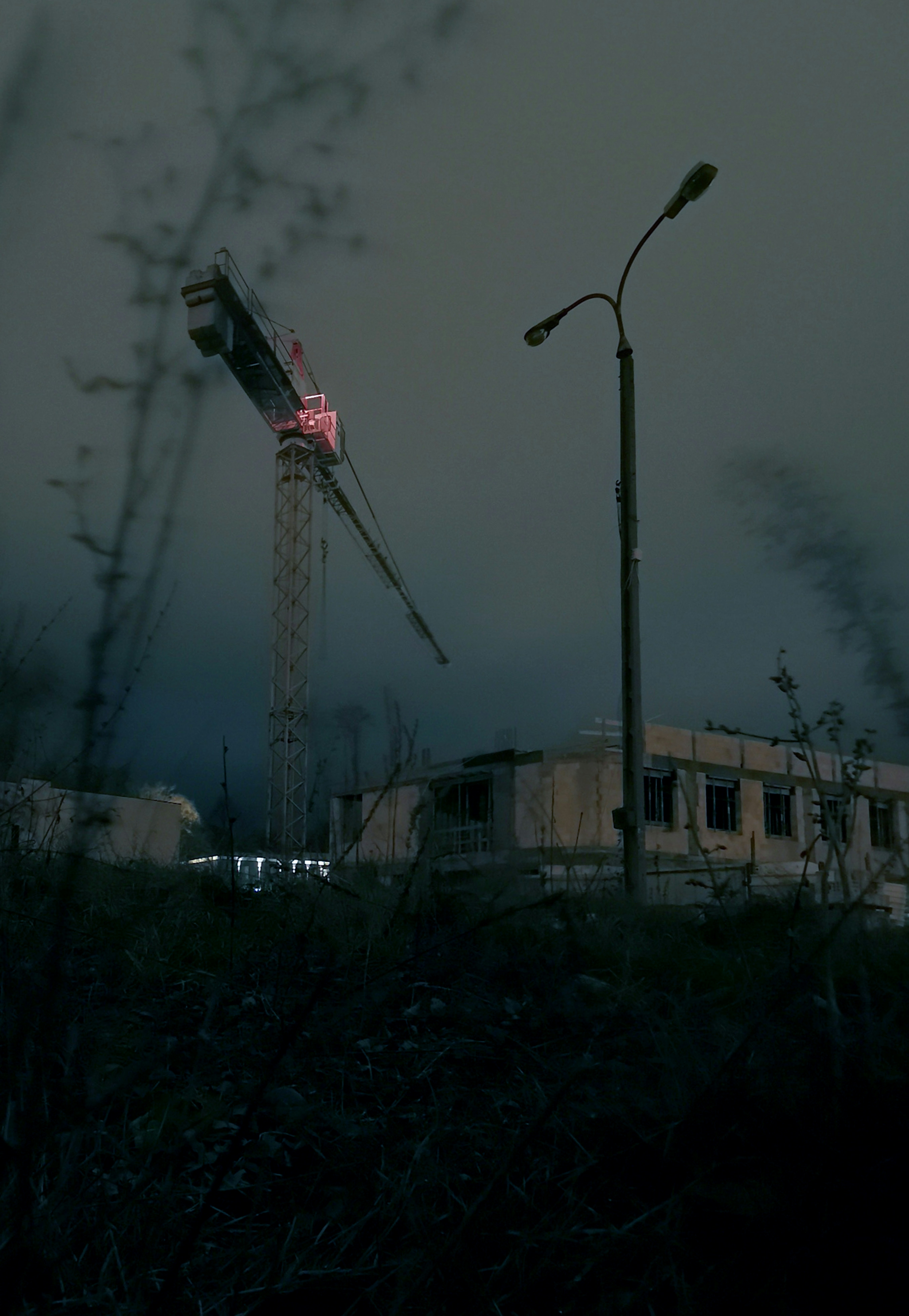 a tall tower sitting next to a street light