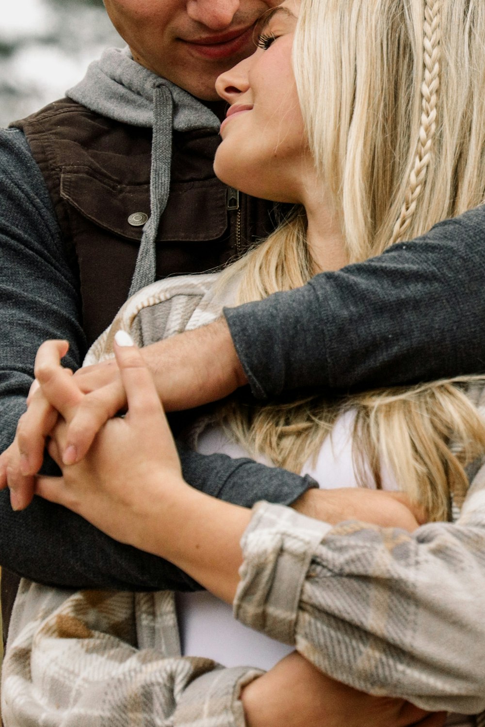 a man and a woman embracing each other