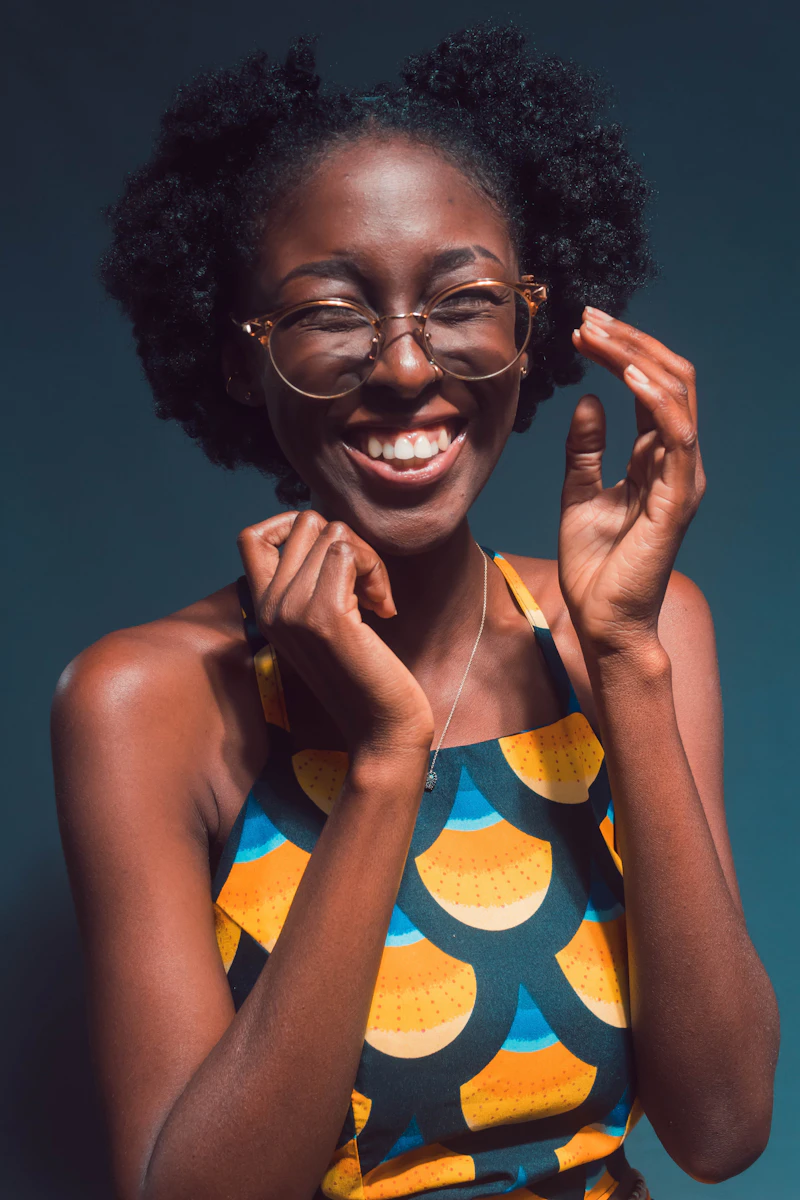 Woman wearing new glasses, smiling