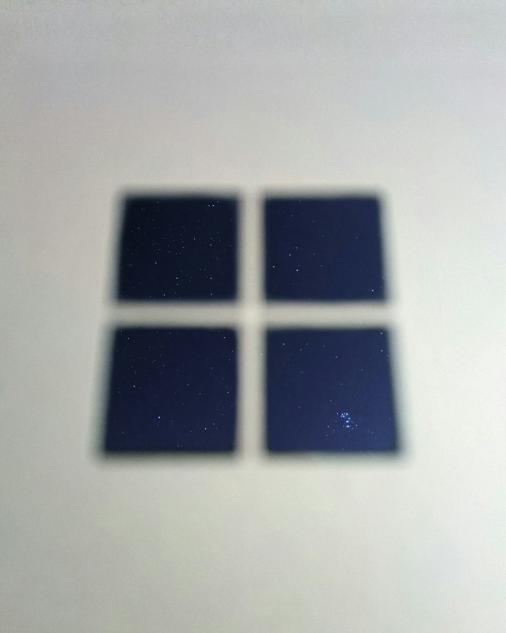 a picture of a window with a star in the background