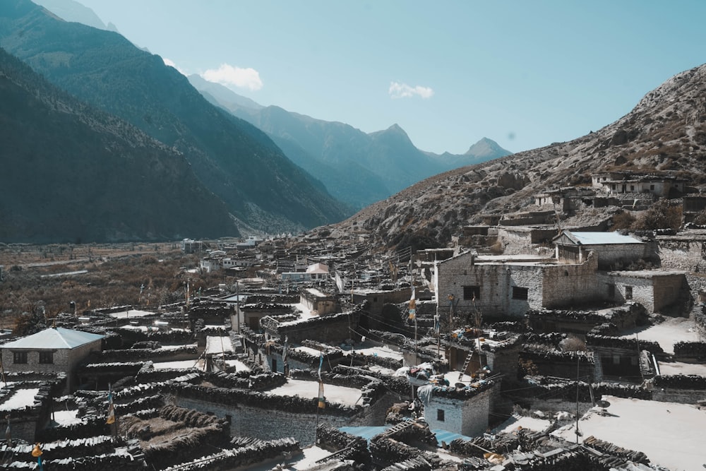 a village in the middle of a mountain range