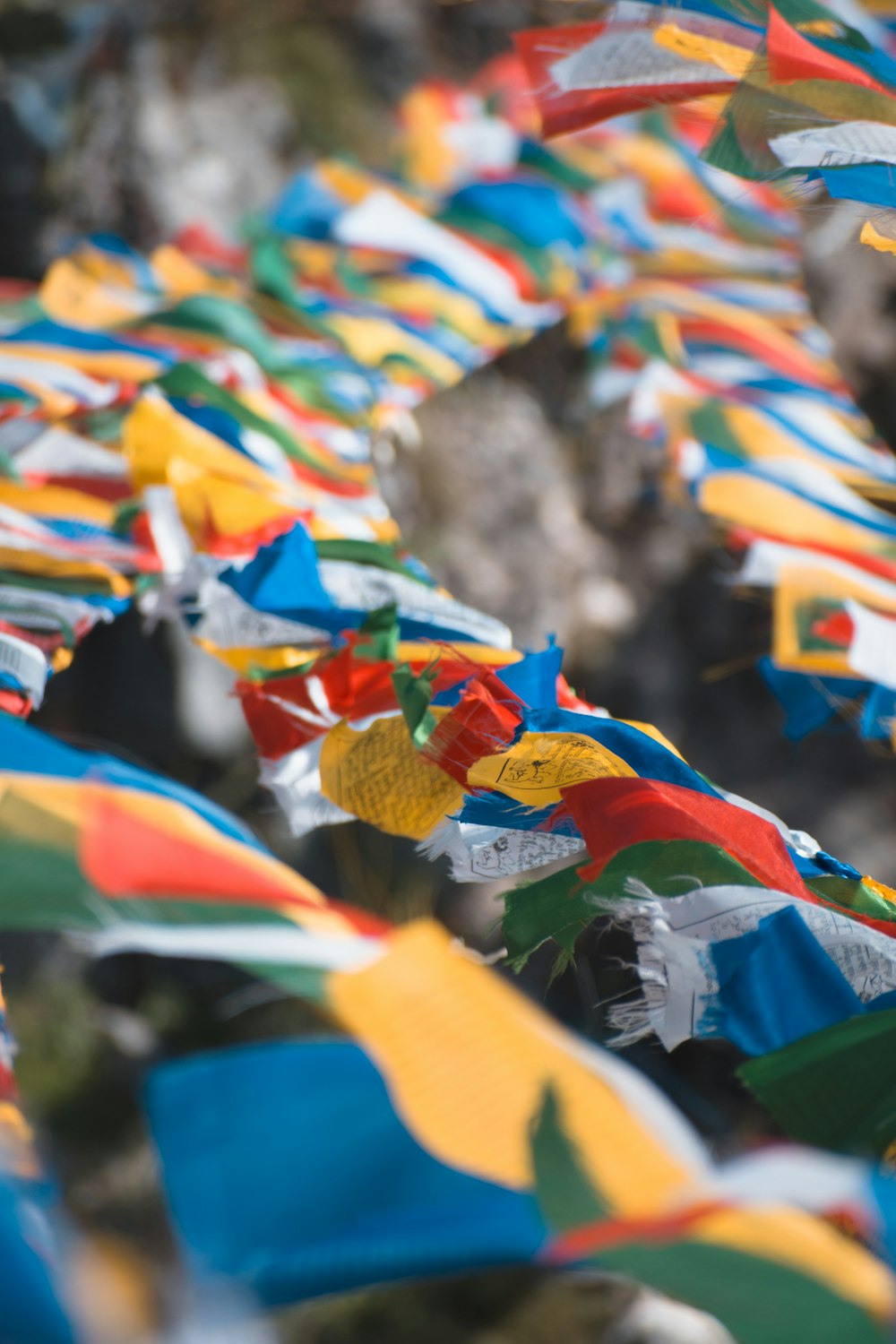 a bunch of colorful umbrellas that are in the air