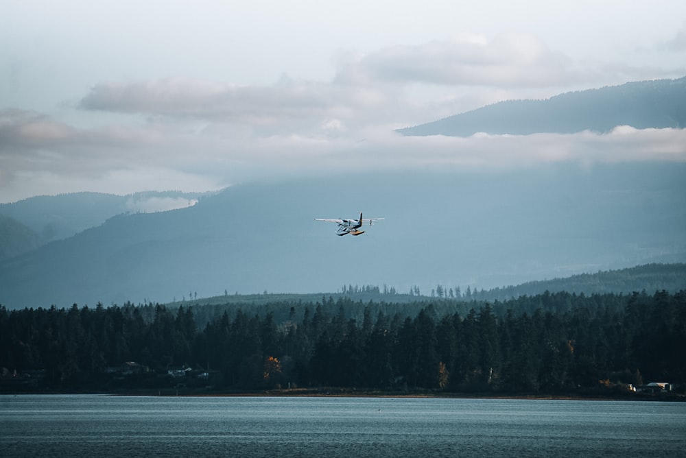 a plane flying over a body of water