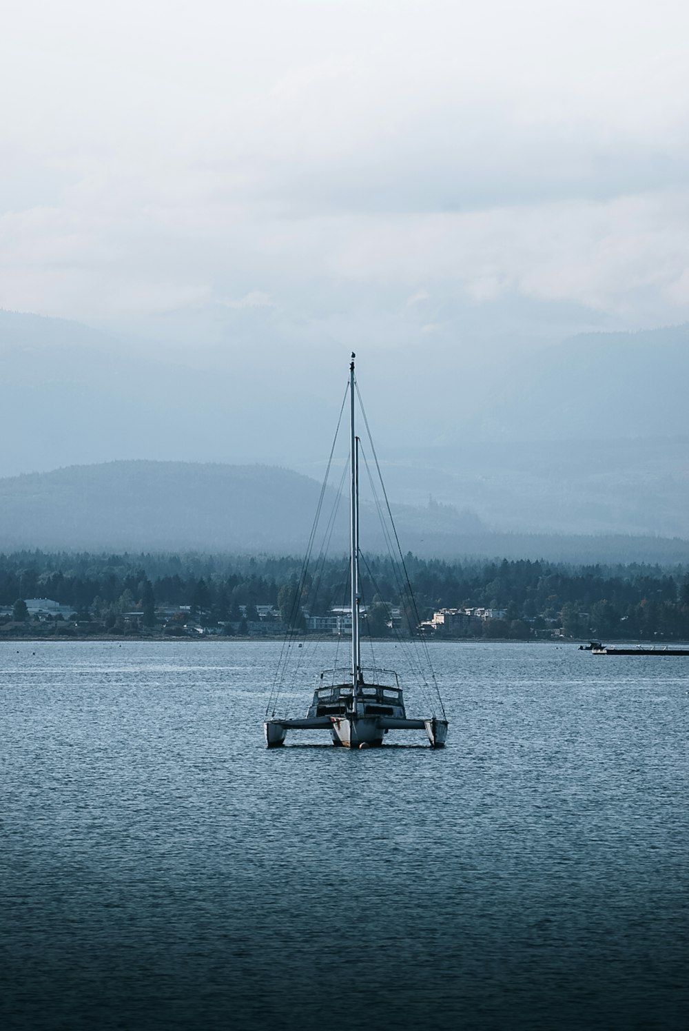 a boat floating on top of a large body of water