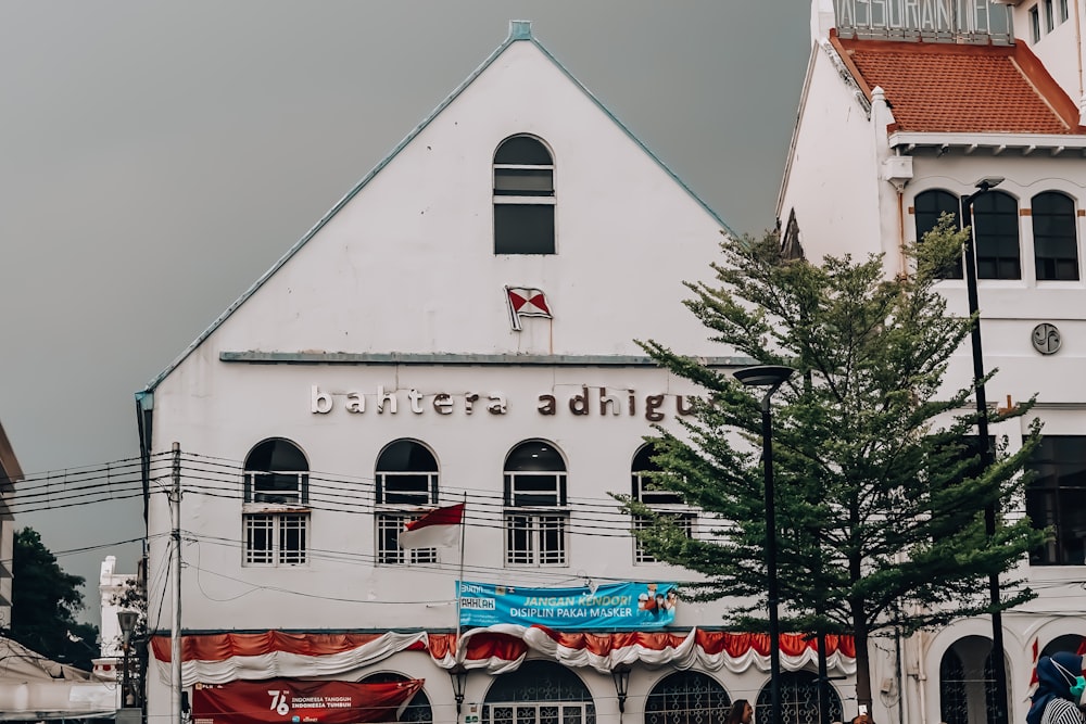 a large white building with a red roof