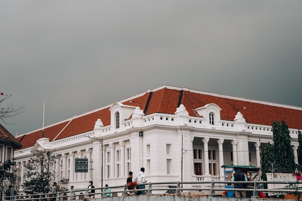 a large white building with a red roof