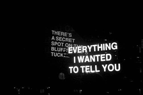 a black and white photo of a street sign