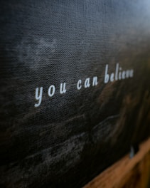 a close up of a wall with writing on it