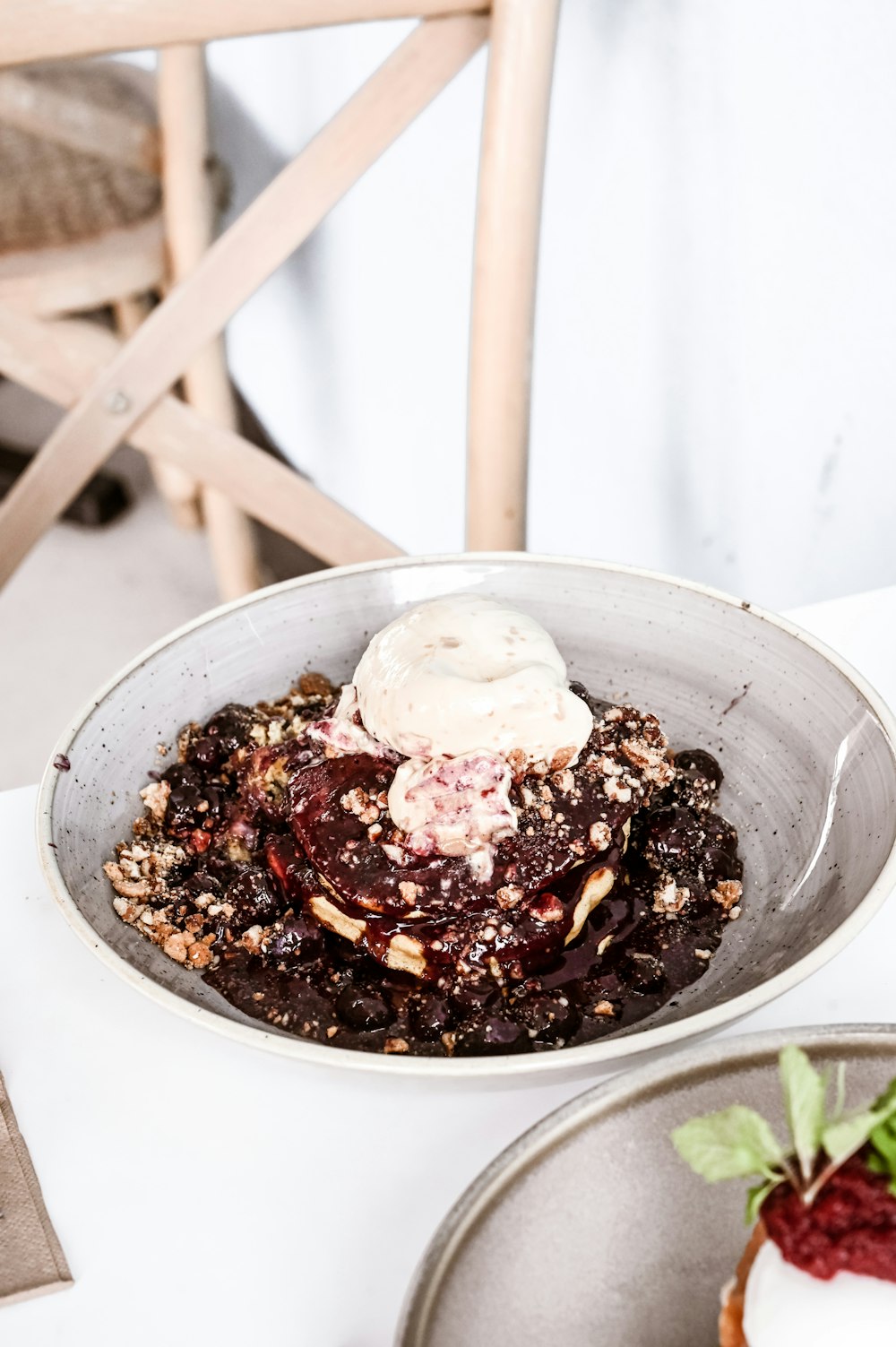 a bowl of food sitting on top of a table