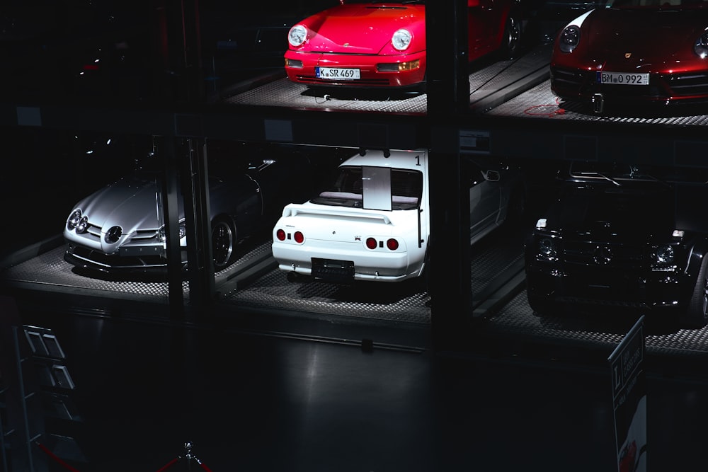 a group of cars parked in a garage