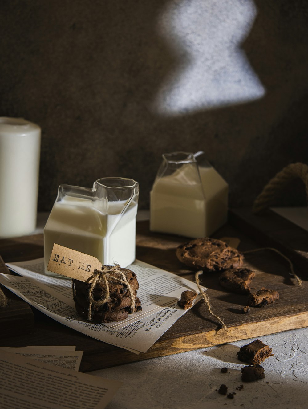 a table topped with milk and cookies on top of a table