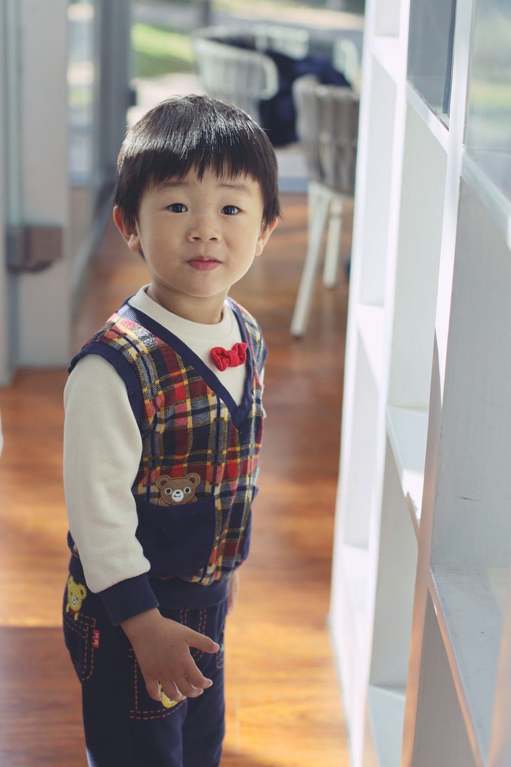 a little boy that is standing in a room