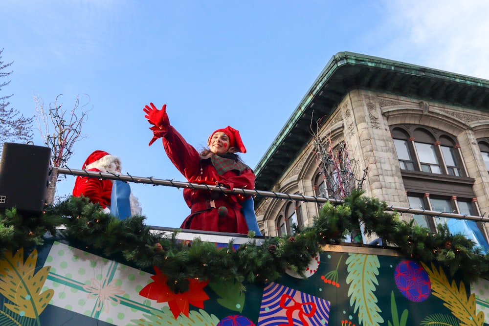 a couple of people that are standing on a balcony