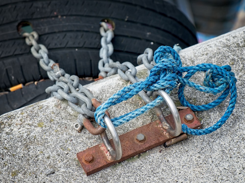 a close up of a chain with a hook on it