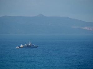 a large boat floating on top of a large body of water