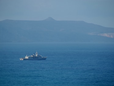 a large boat floating on top of a large body of water