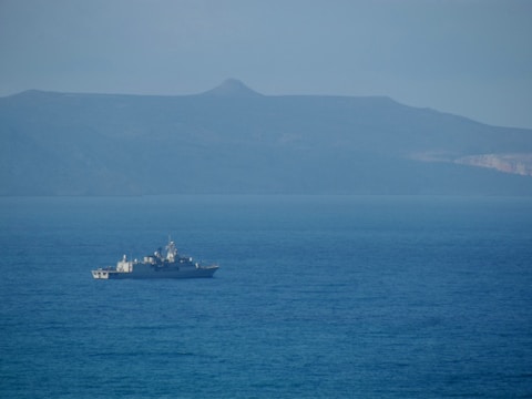 a large boat floating on top of a large body of water