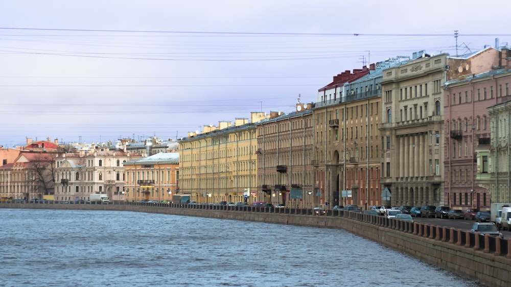 a river running through a city next to tall buildings