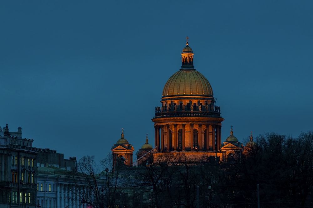 the dome of a building lit up at night