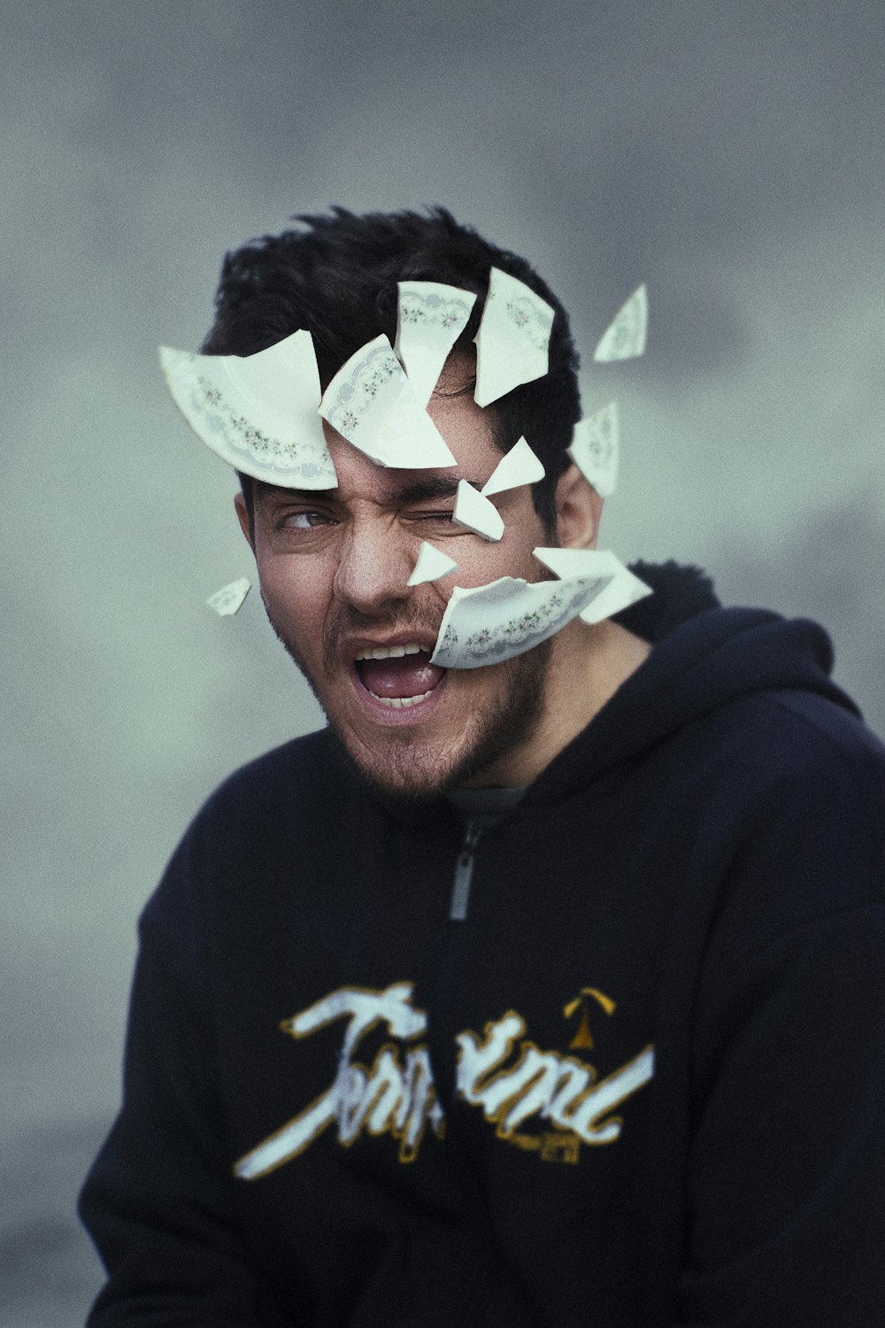 a man with a bunch of papers on his head