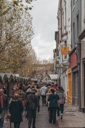 A cozy street market bustling with colorful stalls and smiling locals.