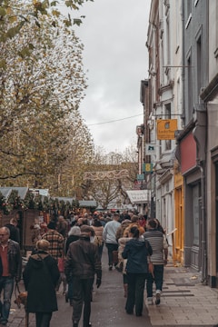 A cozy street market bustling with colorful stalls and smiling locals.