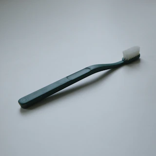 a toothbrush with a toothpaste on top of it