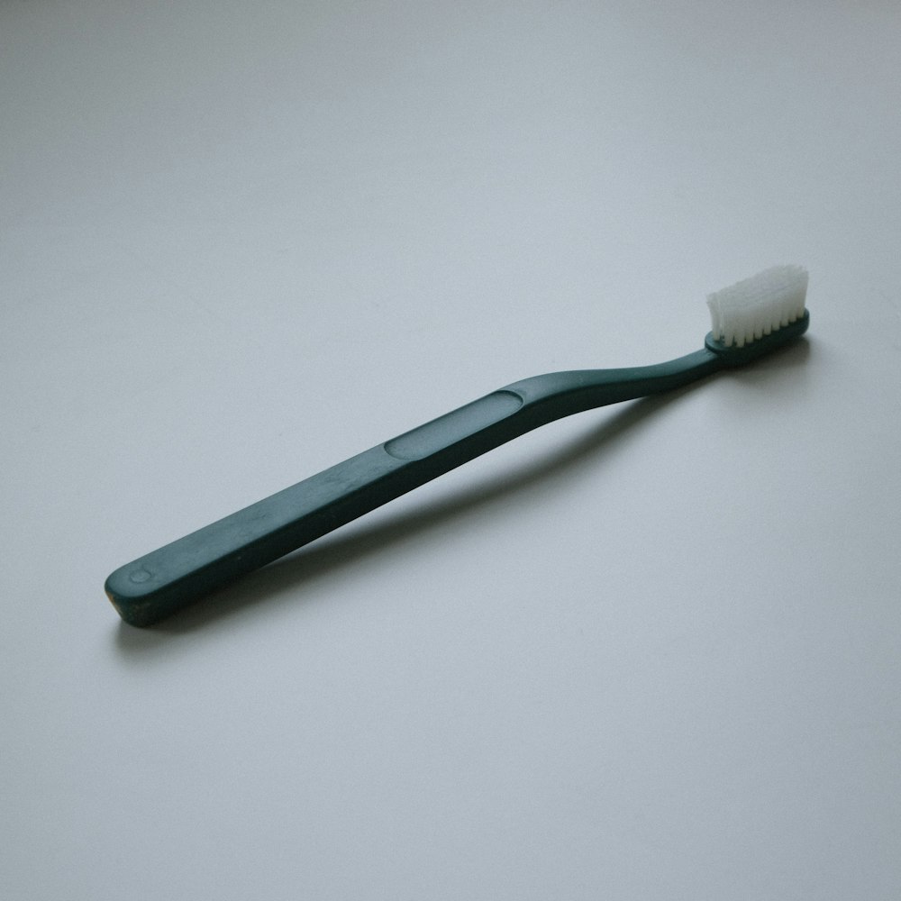 a toothbrush with a toothpaste on top of it