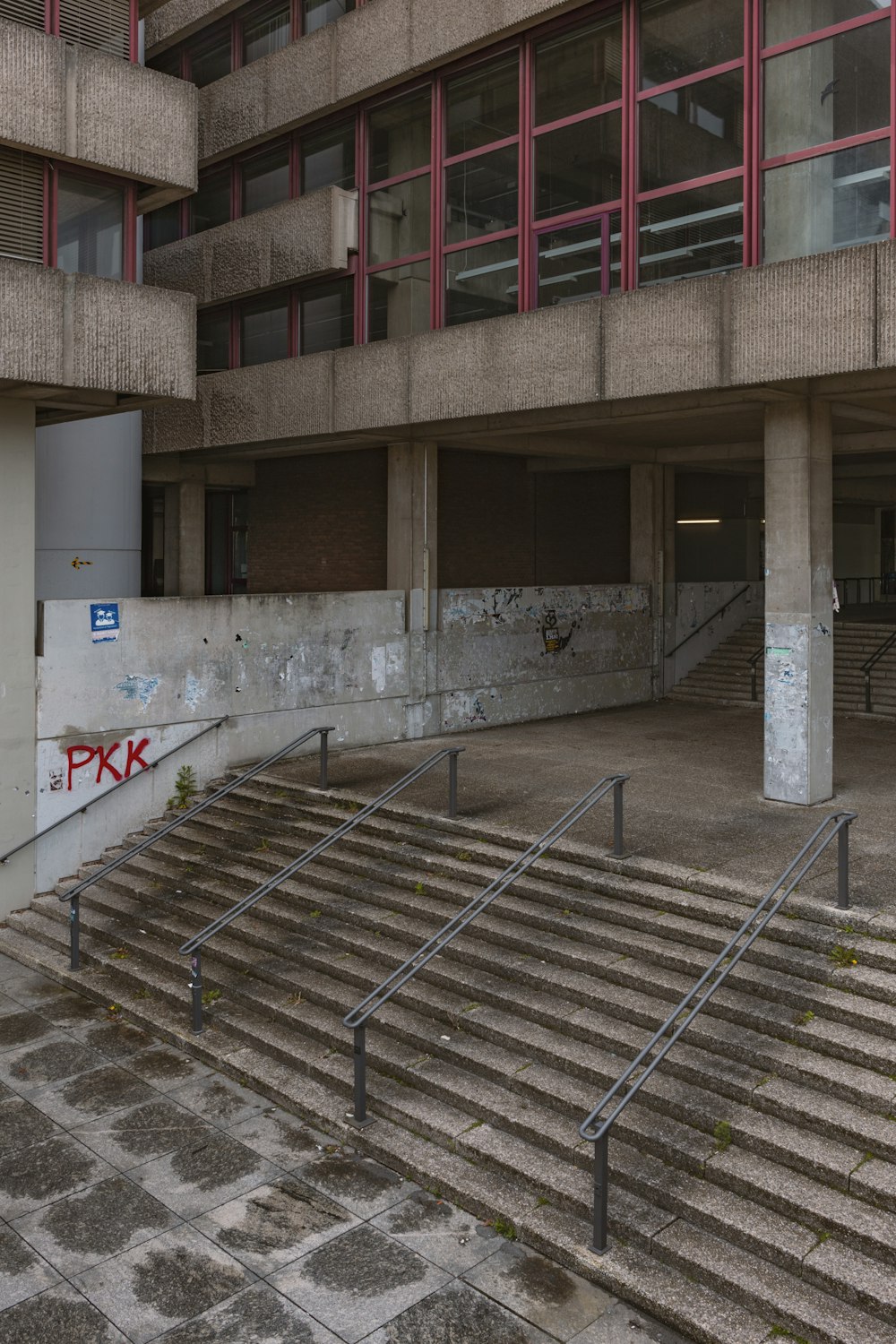an empty building with stairs leading up to it