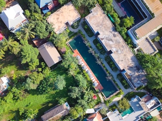 Close-up aerial view of a rooftop pool in a residential area.