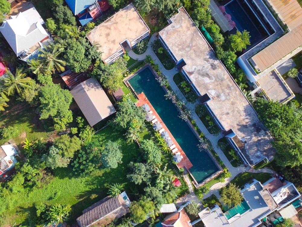 an aerial view of a house surrounded by trees