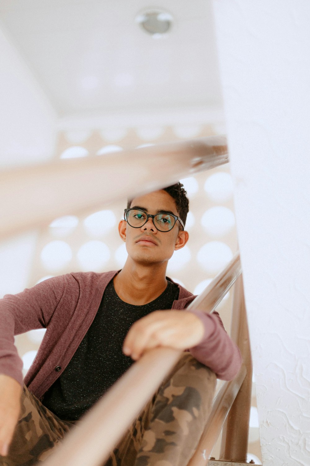 a man sitting on top of a stair case