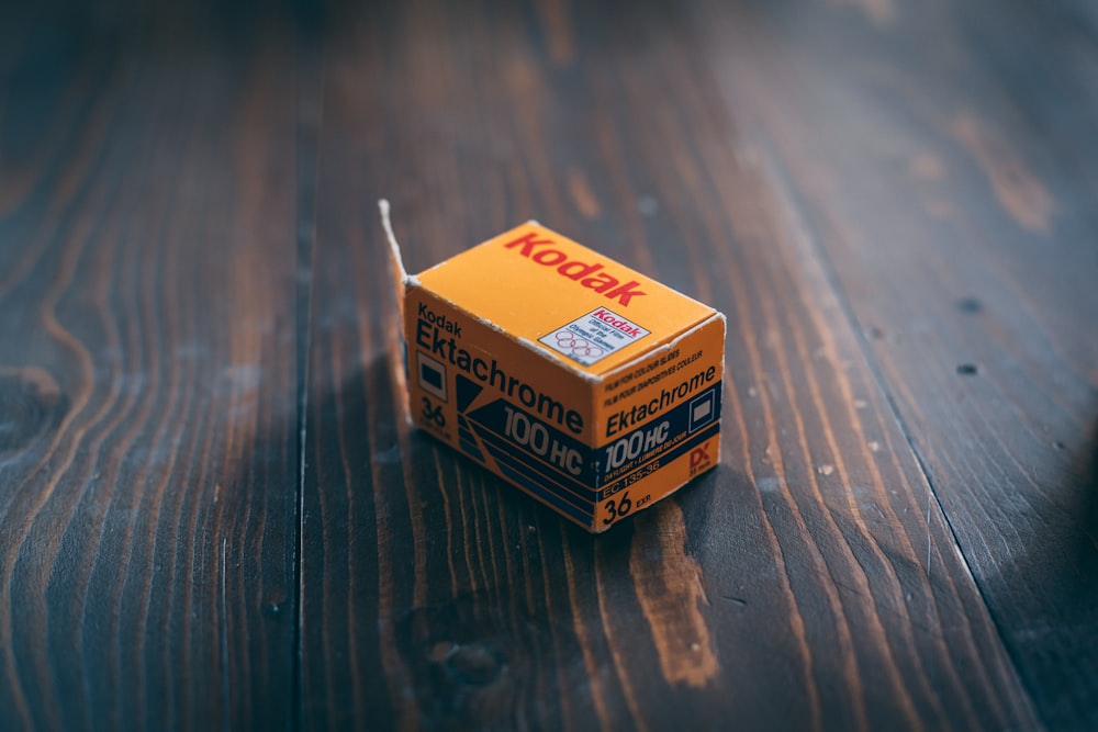 a box of matches sitting on a wooden table