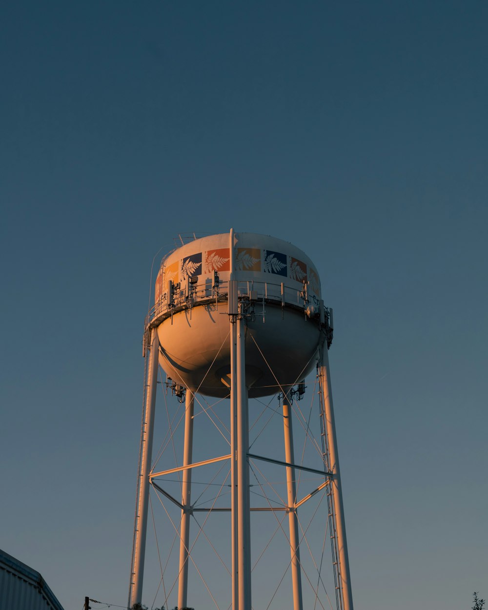 a water tower with a sky background