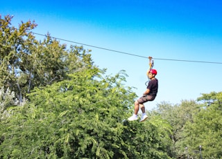 Boy zip lining