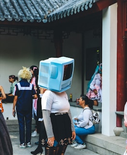 a group of people standing around a building