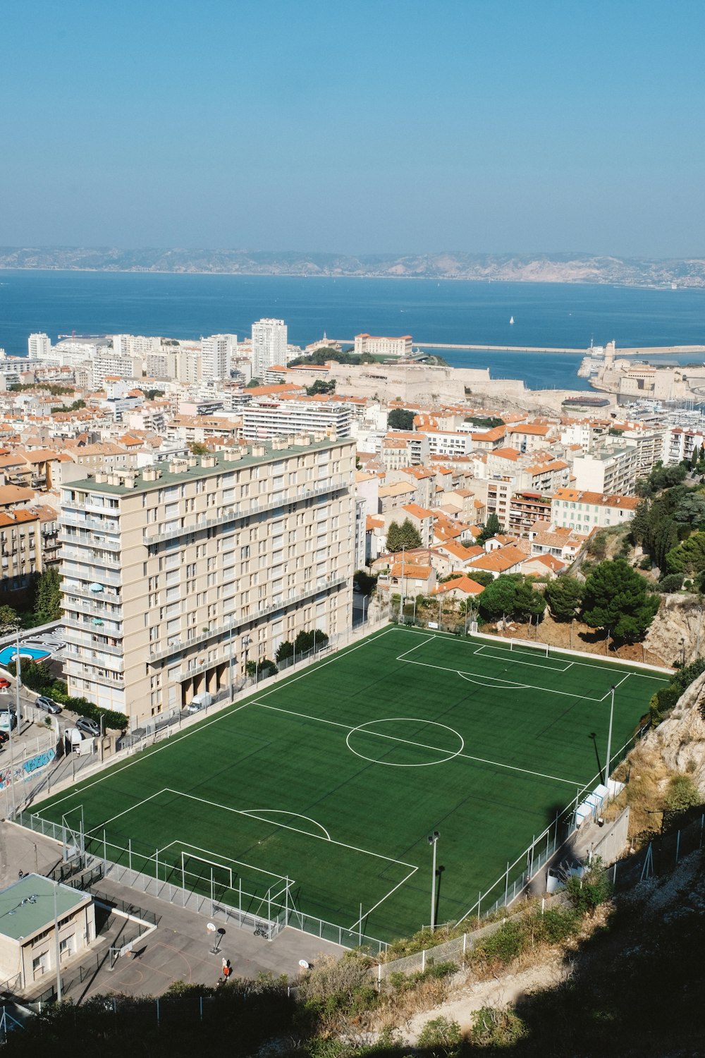 a soccer field in the middle of a city