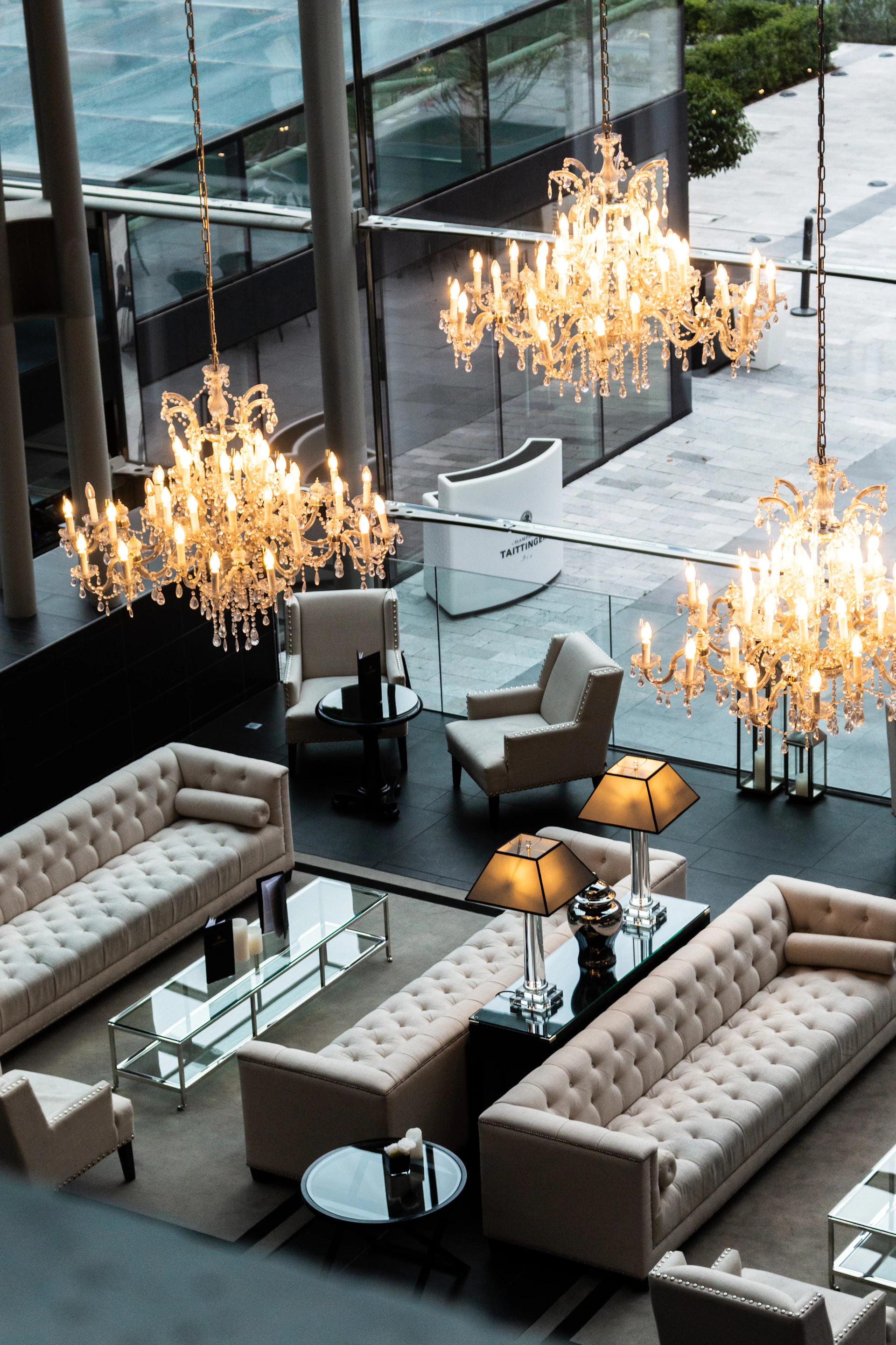 a living room filled with furniture and a chandelier