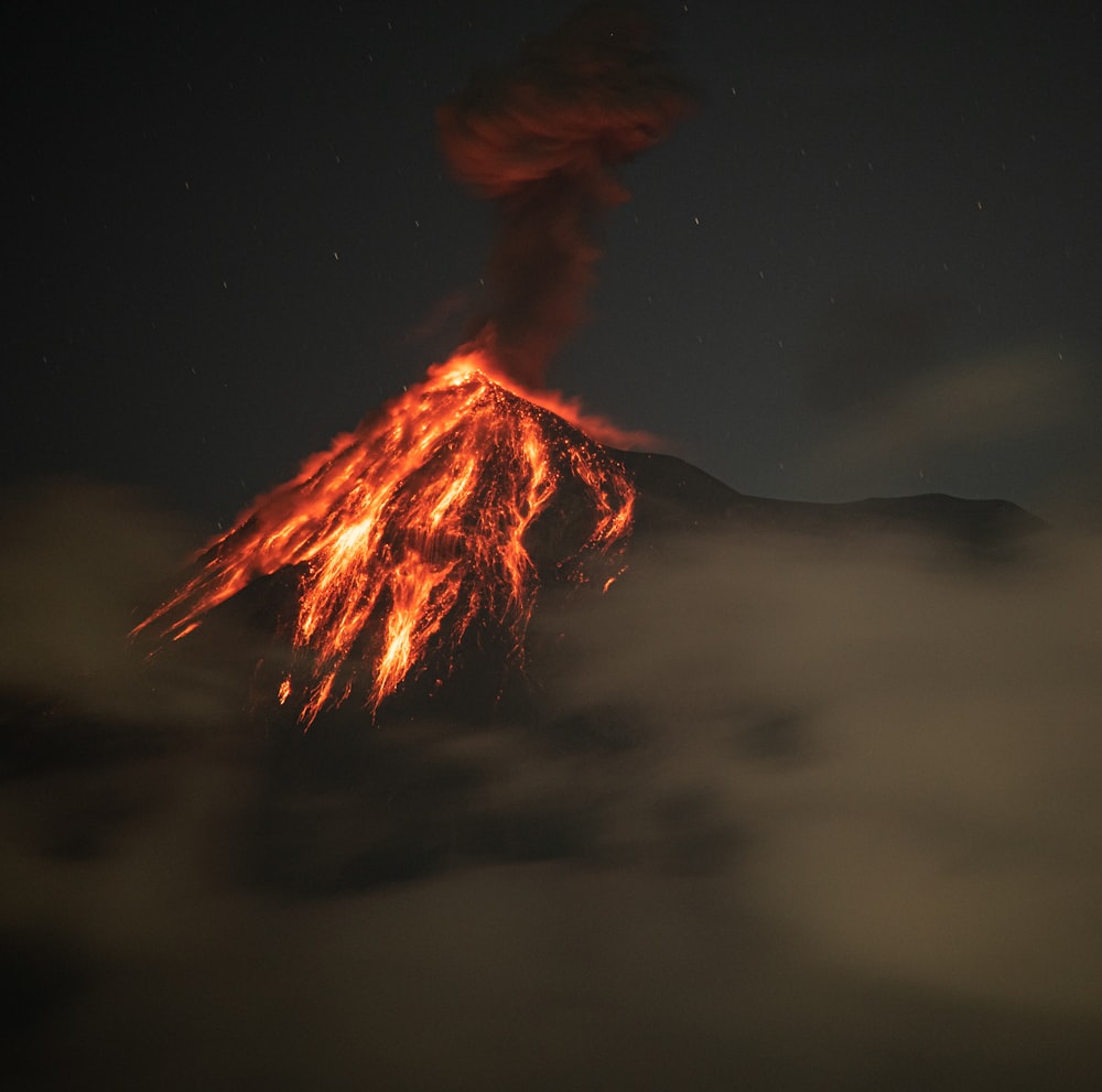 a volcano spewing lava into the night sky