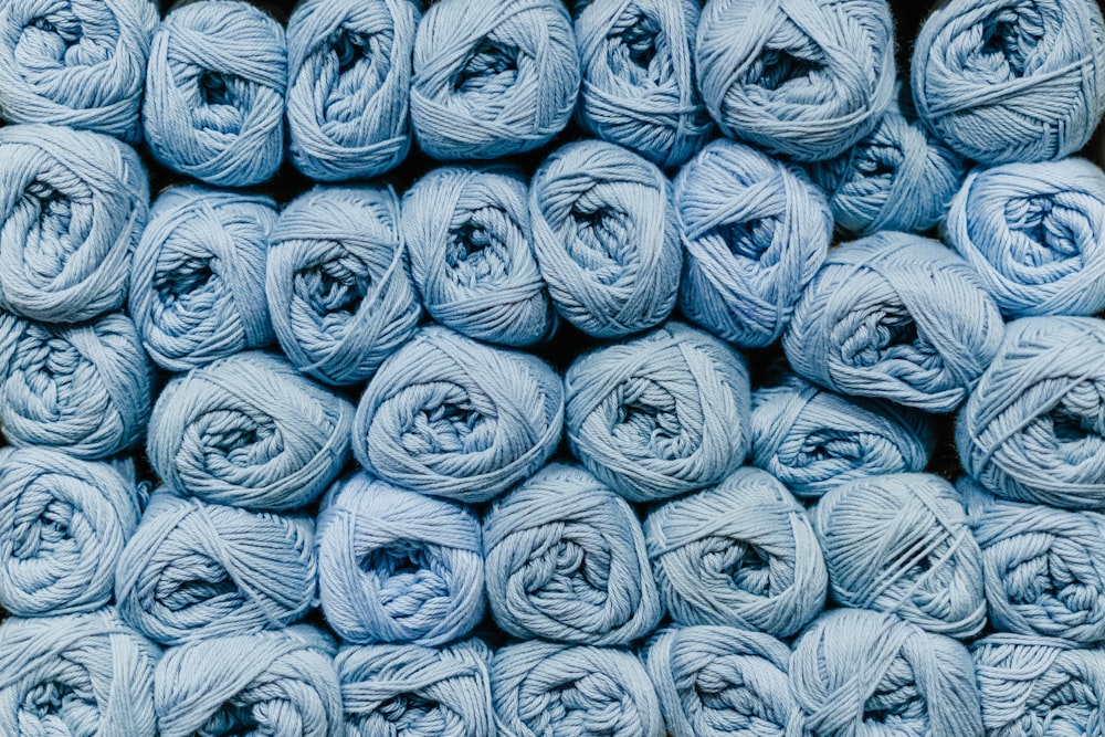 a bunch of balls of yarn sitting on top of each other