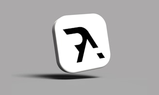 a white square with a black letter on it